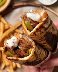Chicken shawarma wrap comes with ketchup and chilli with an option of adding our signature garlic sauce.